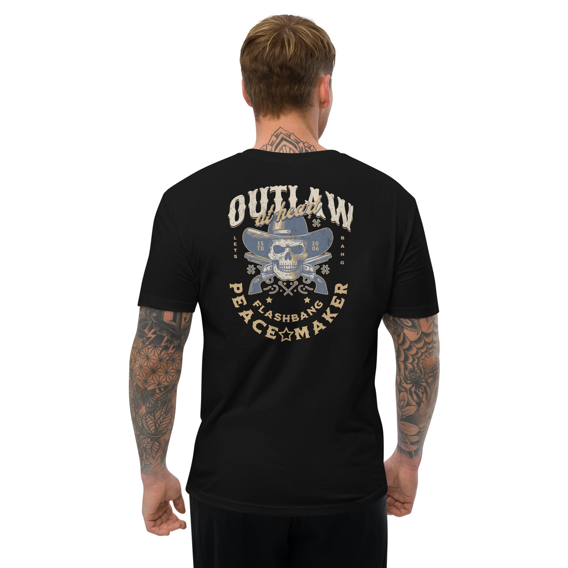 Man wearing a black t-shirt with a graphic design on the back, featuring text and a skull.