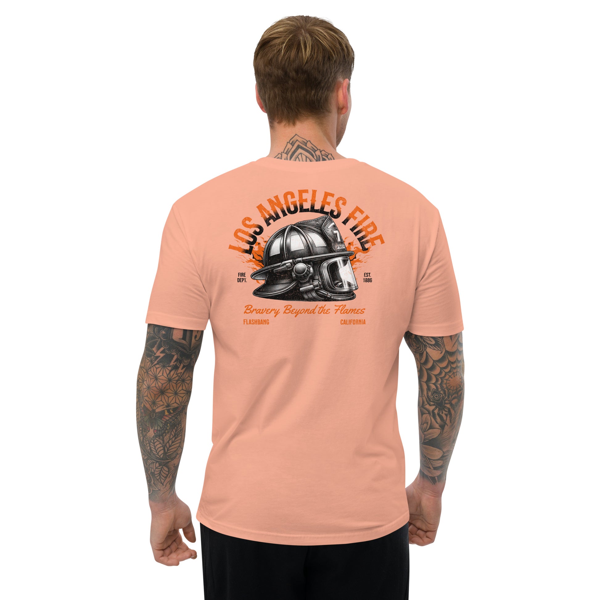 Man wearing a peach t-shirt with 'Los Angeles Fire' graphic on the back, on a white background