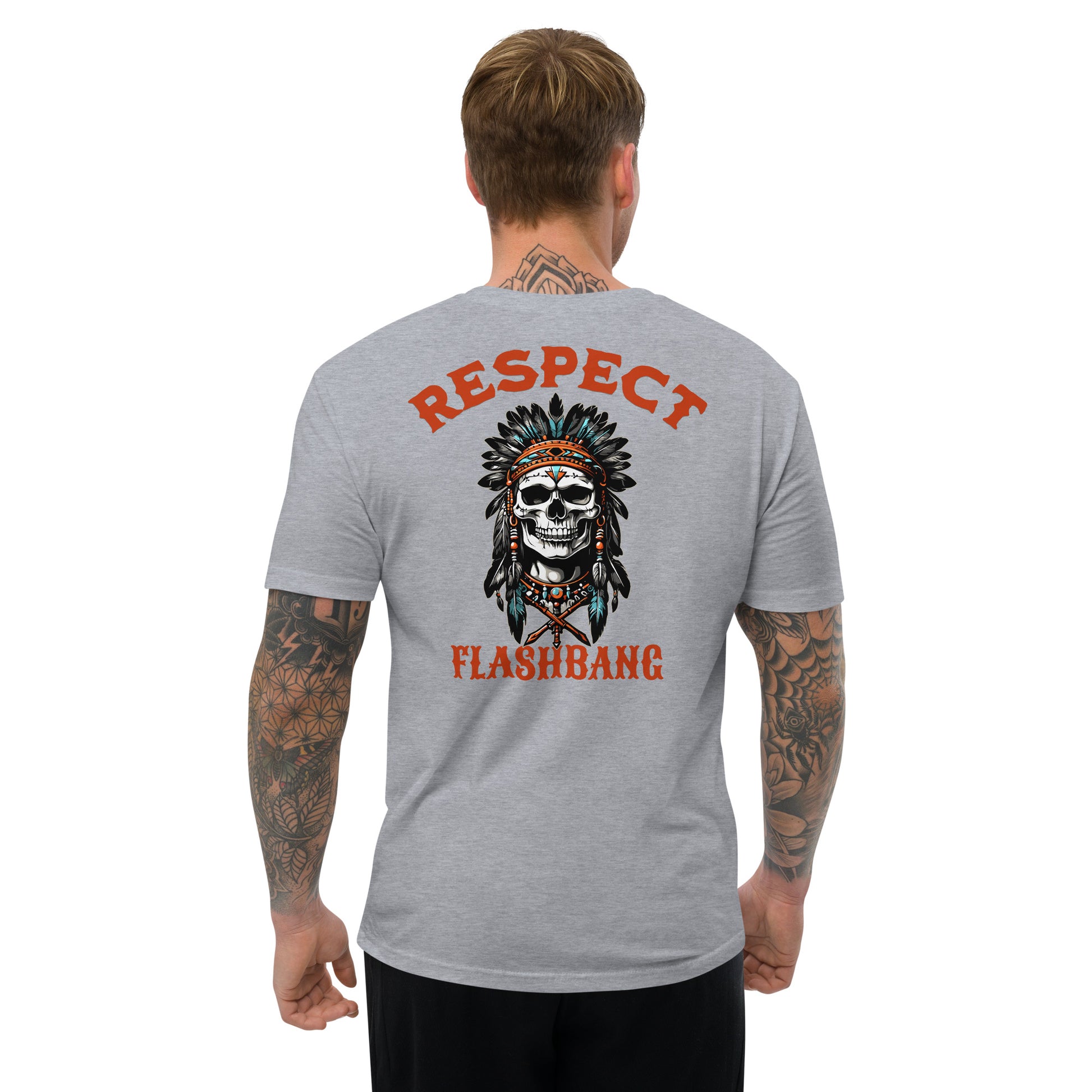 Gray t-shirt with skull and headdress design on the back, worn by a person.