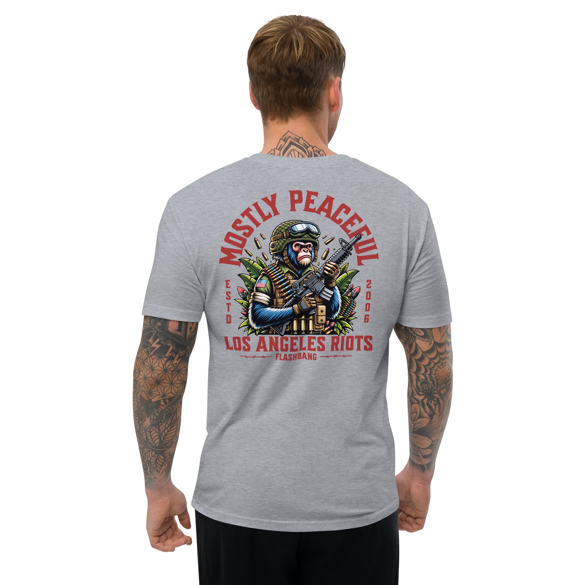 Gray t-shirt with graphic design and text on the back, worn by a person.