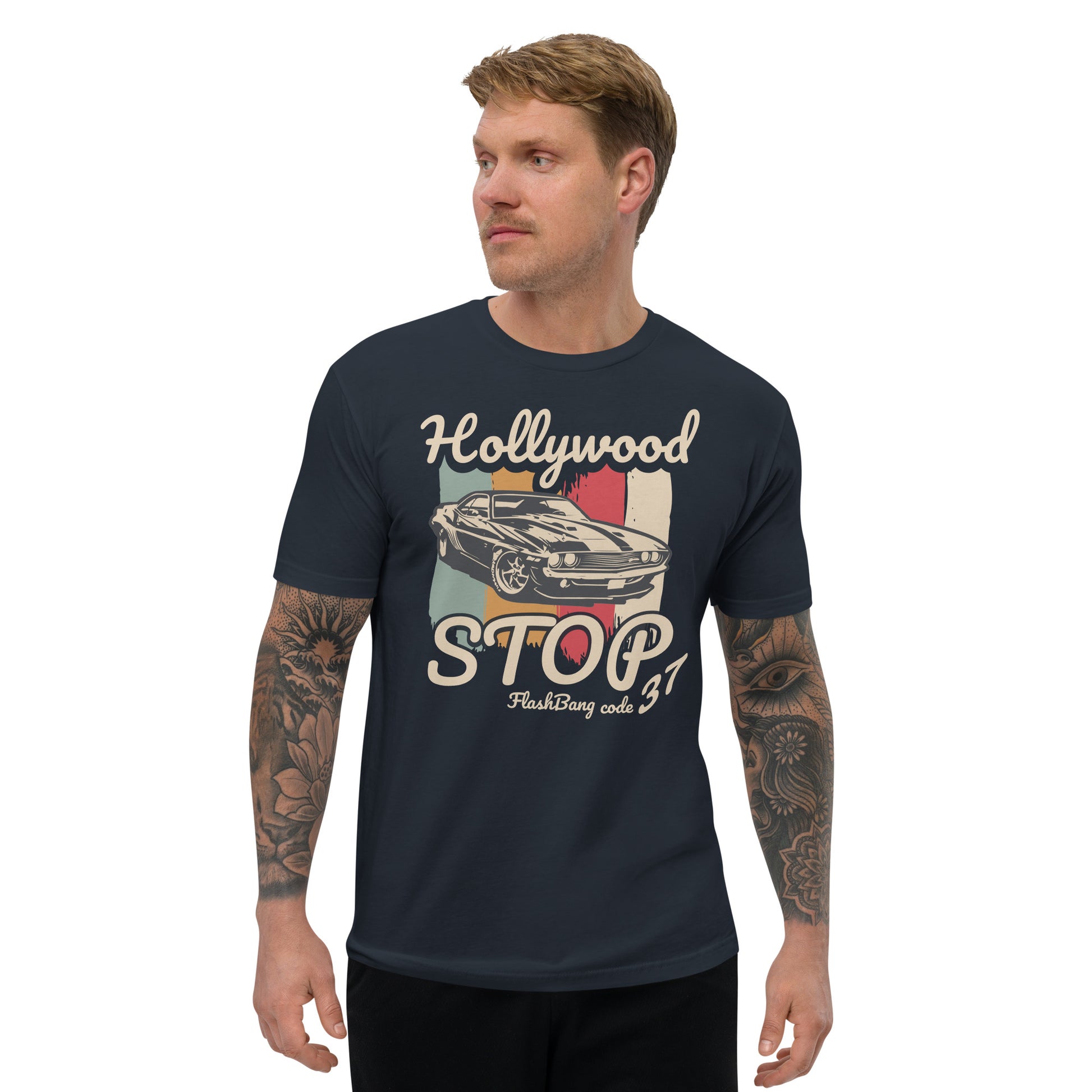 Man wearing a navy blue t-shirt with a graphic design on a white background