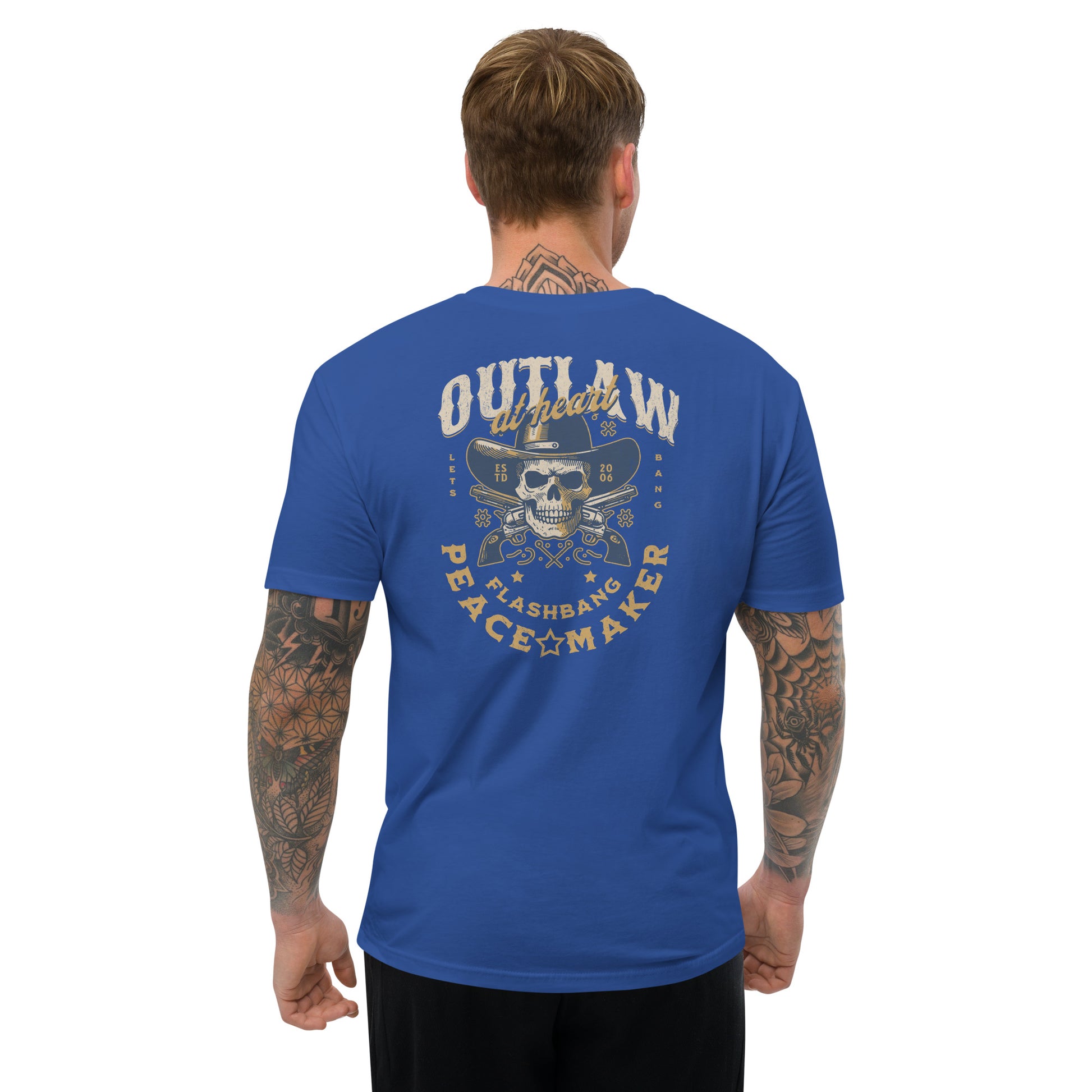 Man wearing a blue t-shirt with a graphic design on the back, standing against a white background