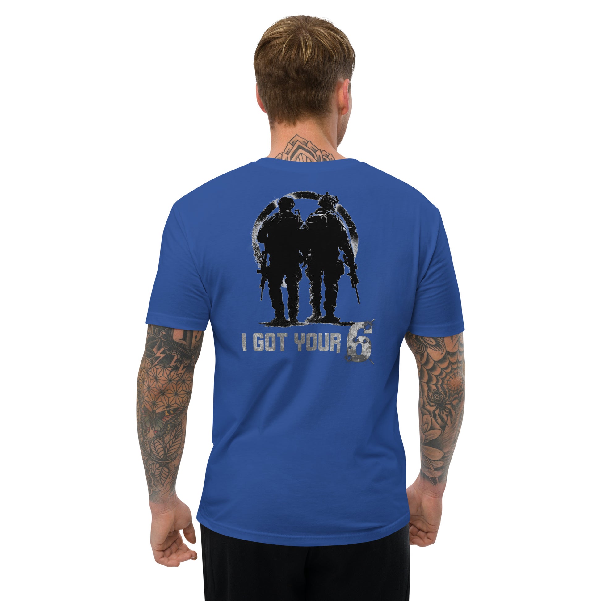 Man wearing a blue t-shirt with a graphic design on the back, standing against a white background.