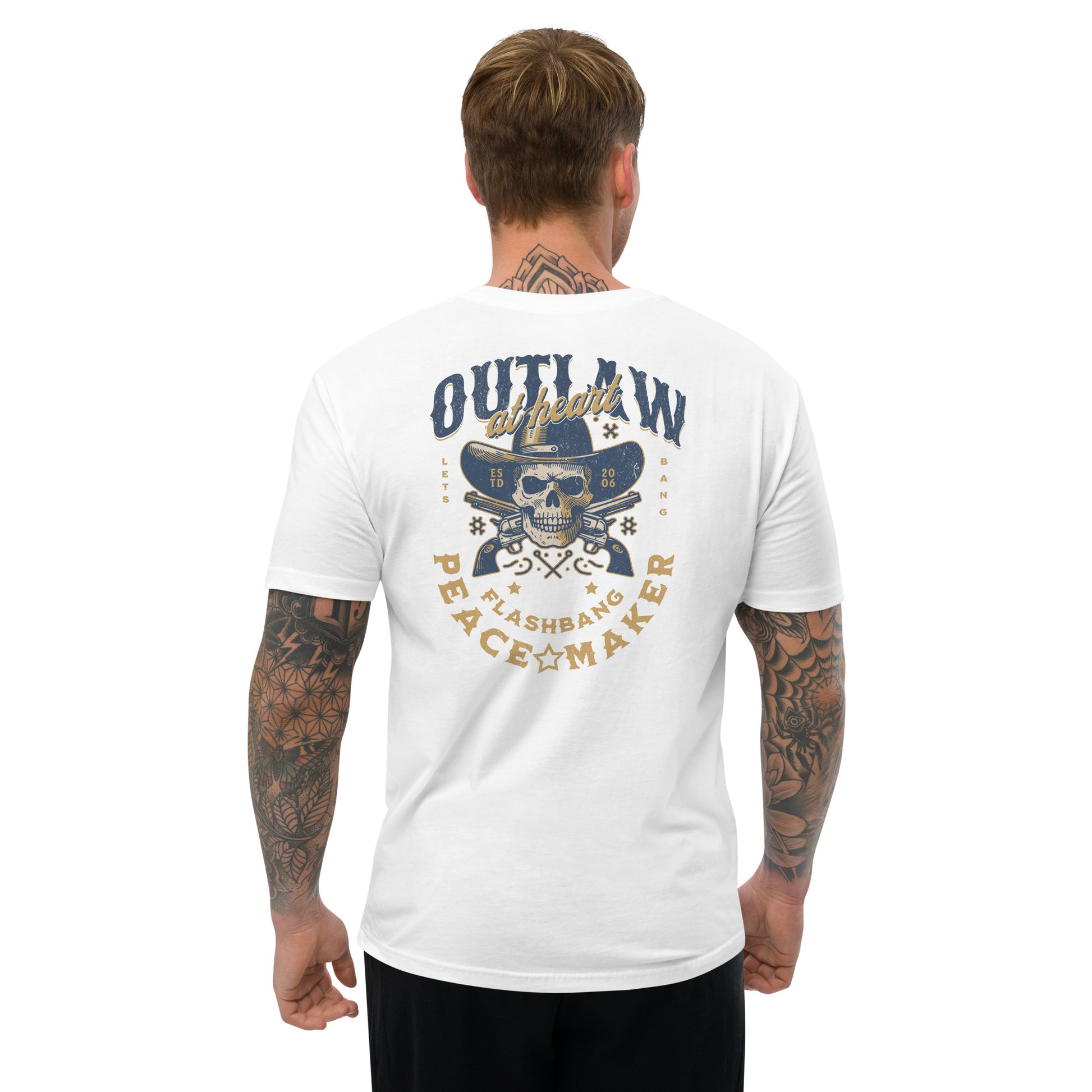 Man wearing a white t-shirt with a graphic design on the back, featuring text and a skull.