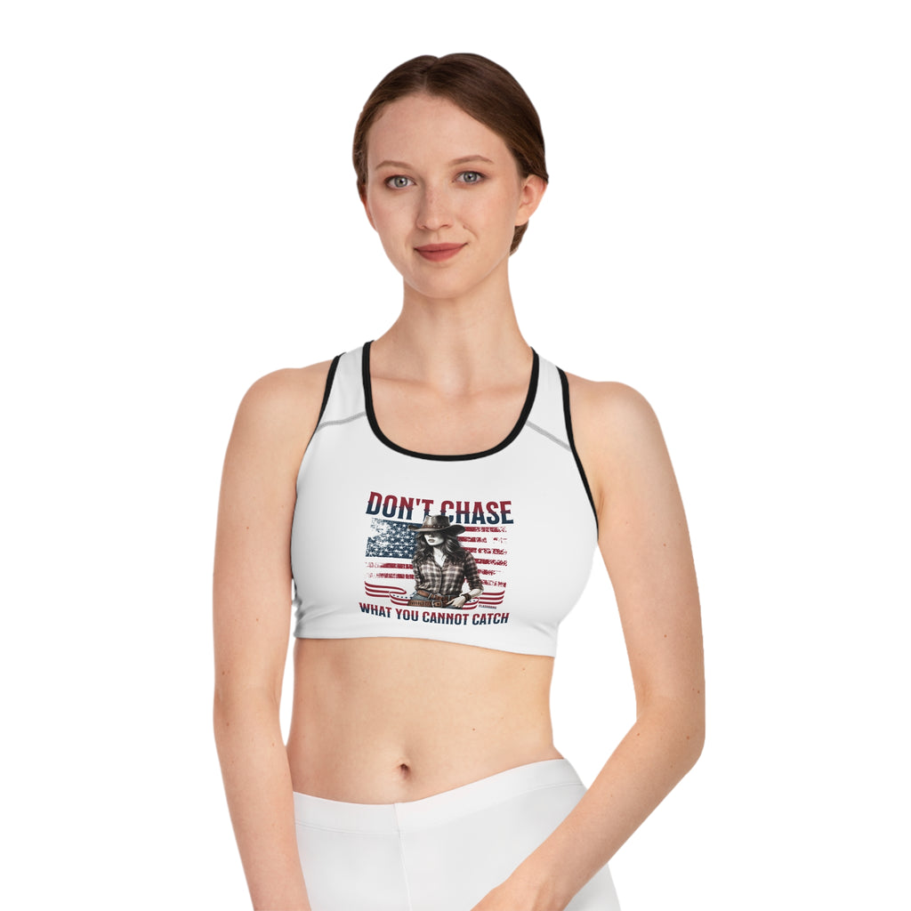 Woman wearing a sports bra with a graphic design and text on a white background