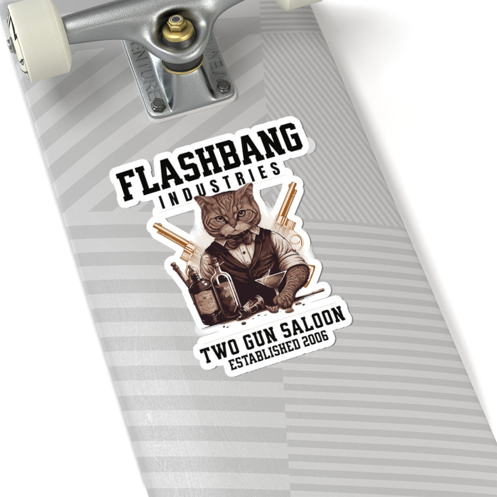 Skateboard with a 'Flashbang Industries' sticker featuring a cat in a saloon setting.