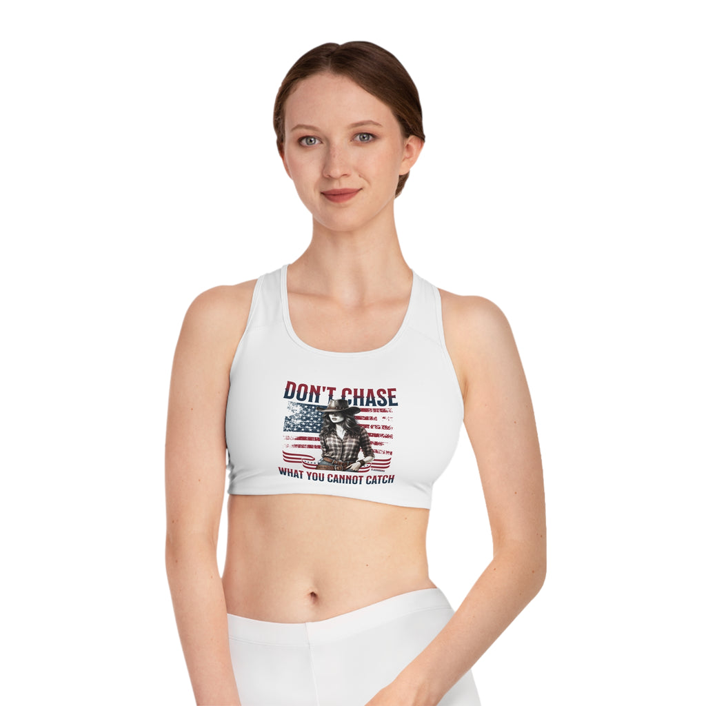 Woman wearing a white sports bra with graphic design and text on a white background