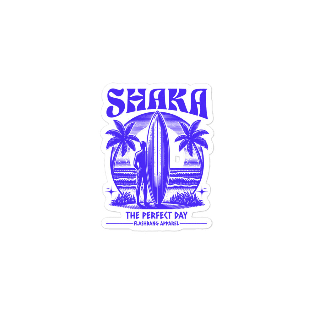 Sticker design with a surfer, palm trees, and 'Shaka The Perfect Day' text on a white background.