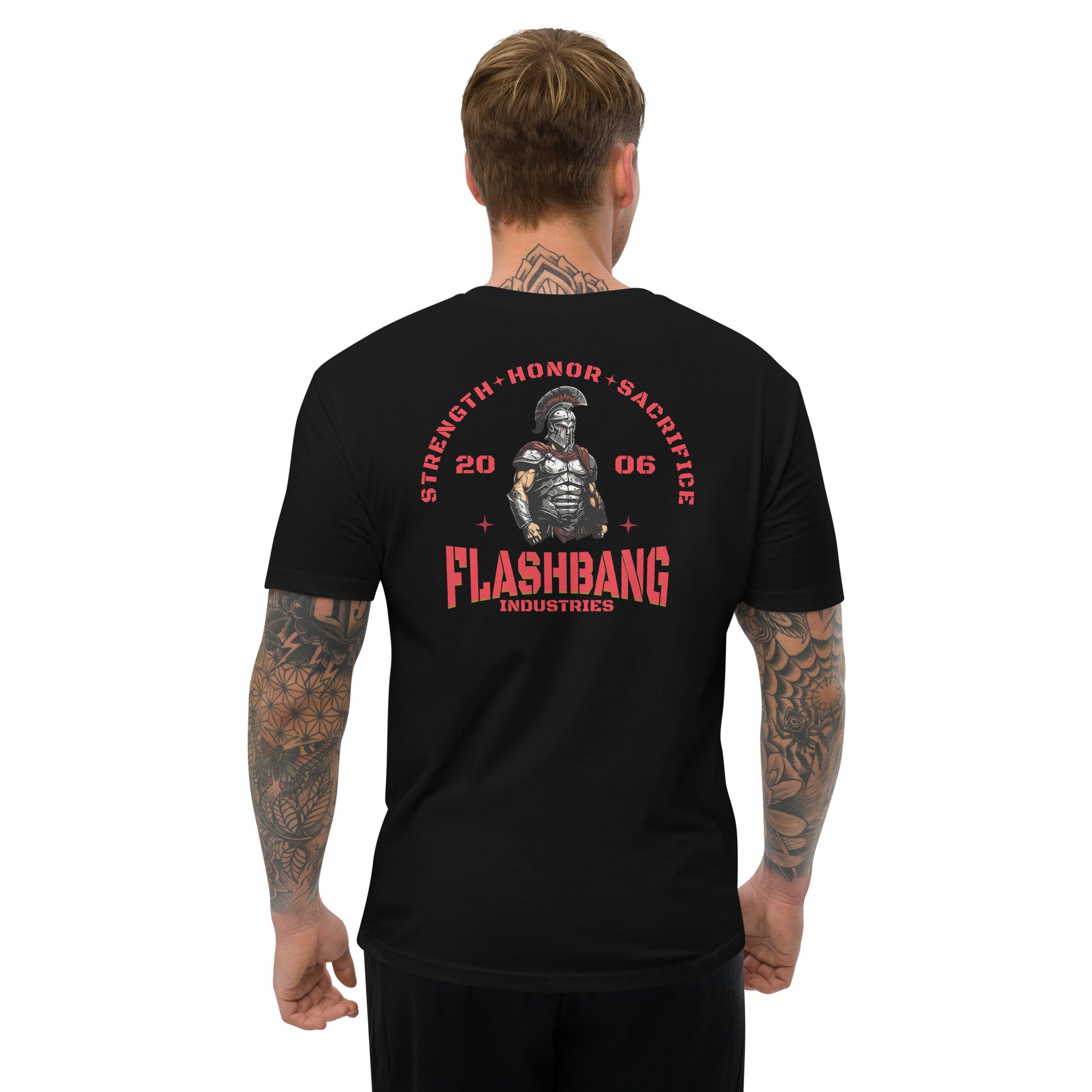 Man wearing a black t-shirt with red and white text and graphics on the back, on a white background.