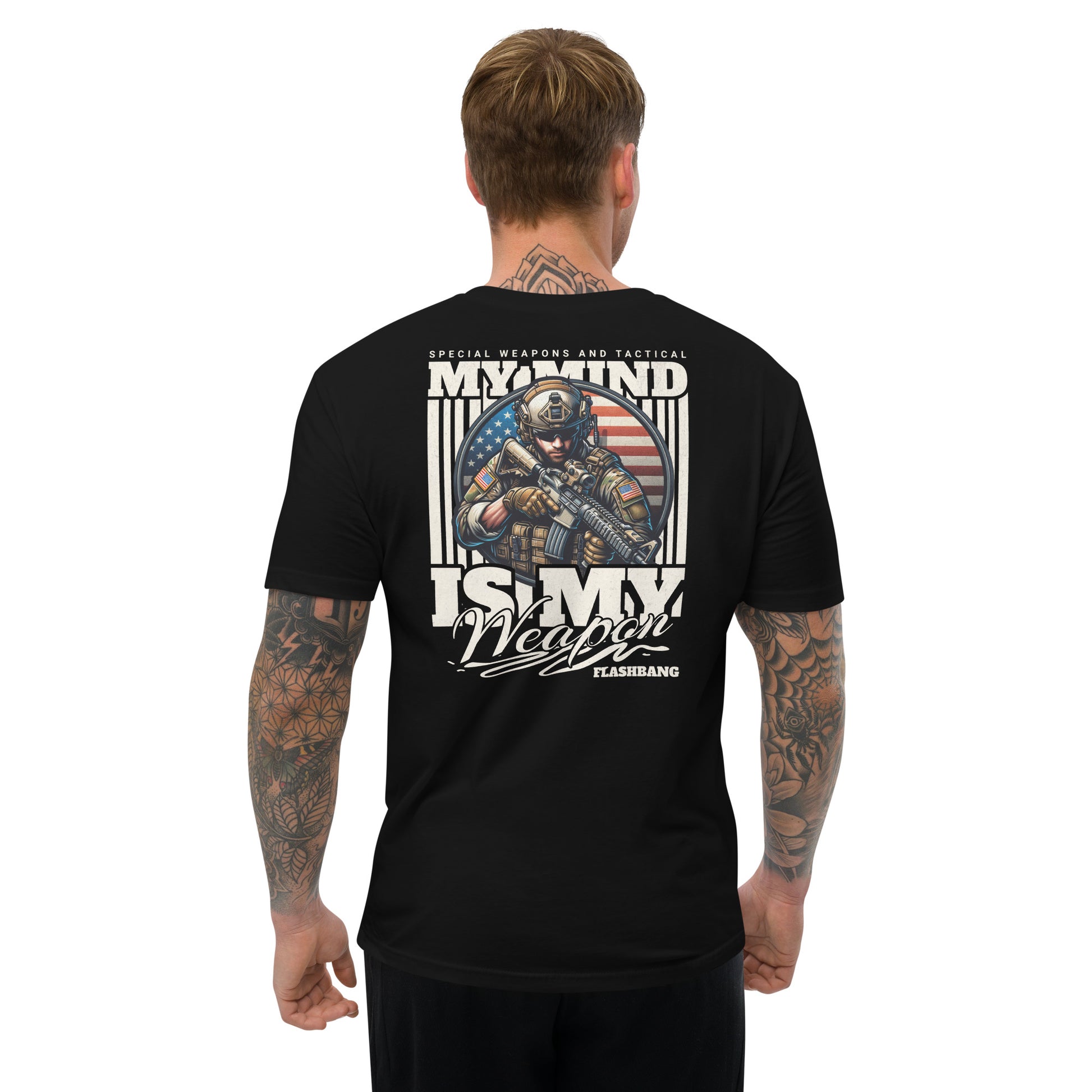 Black t-shirt with graphic design on the back, worn by a person.