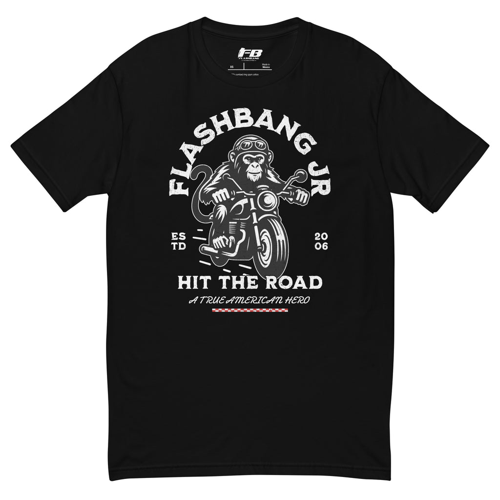 Black t-shirt with a graphic design of a monkey on a motorcycle and text 'Flashbang Jr. Hit the Road' on a white background.