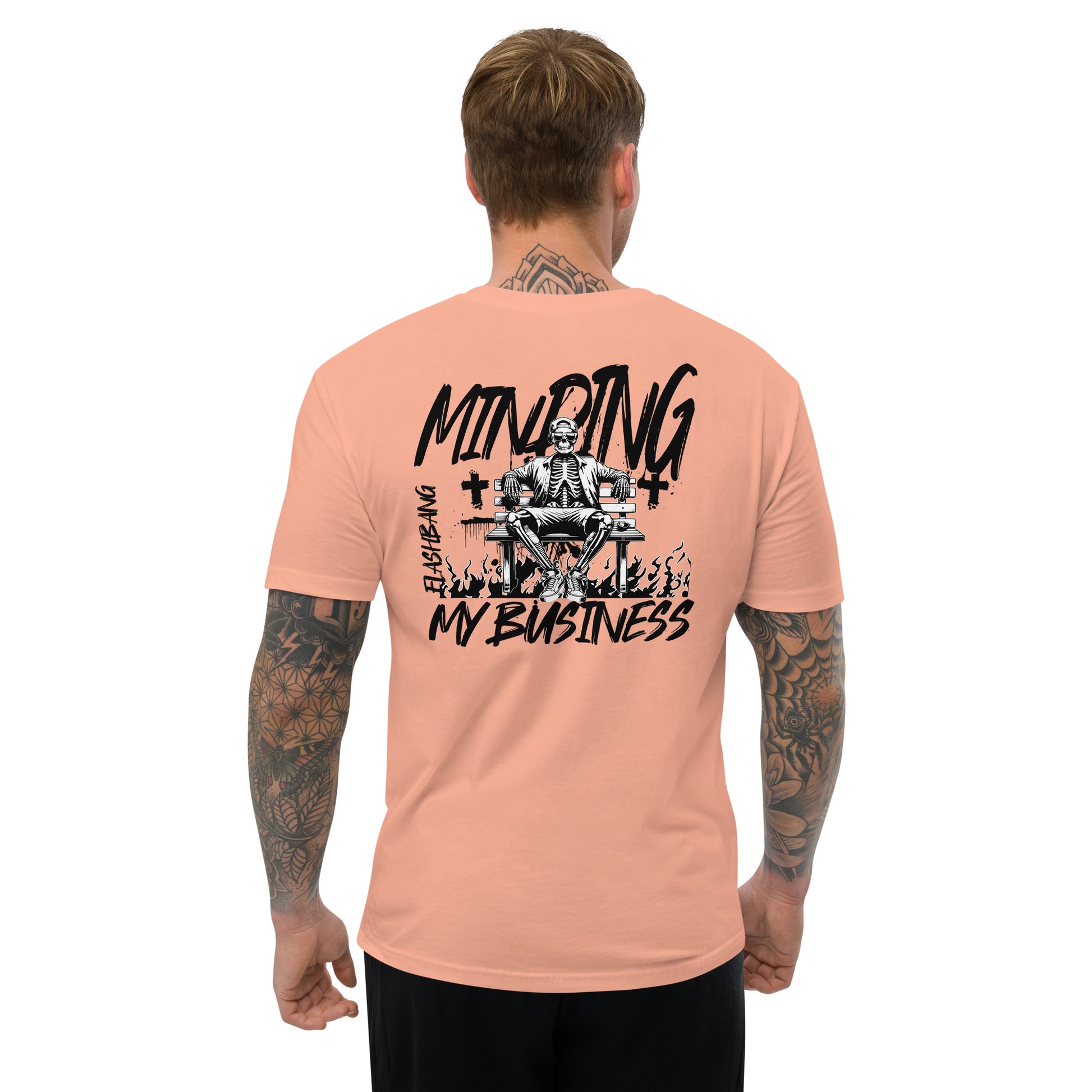 Minding My Business Lite T-shirt with a skeleton graphic and humorous quote - Back View - Desert Pink- Model Guy