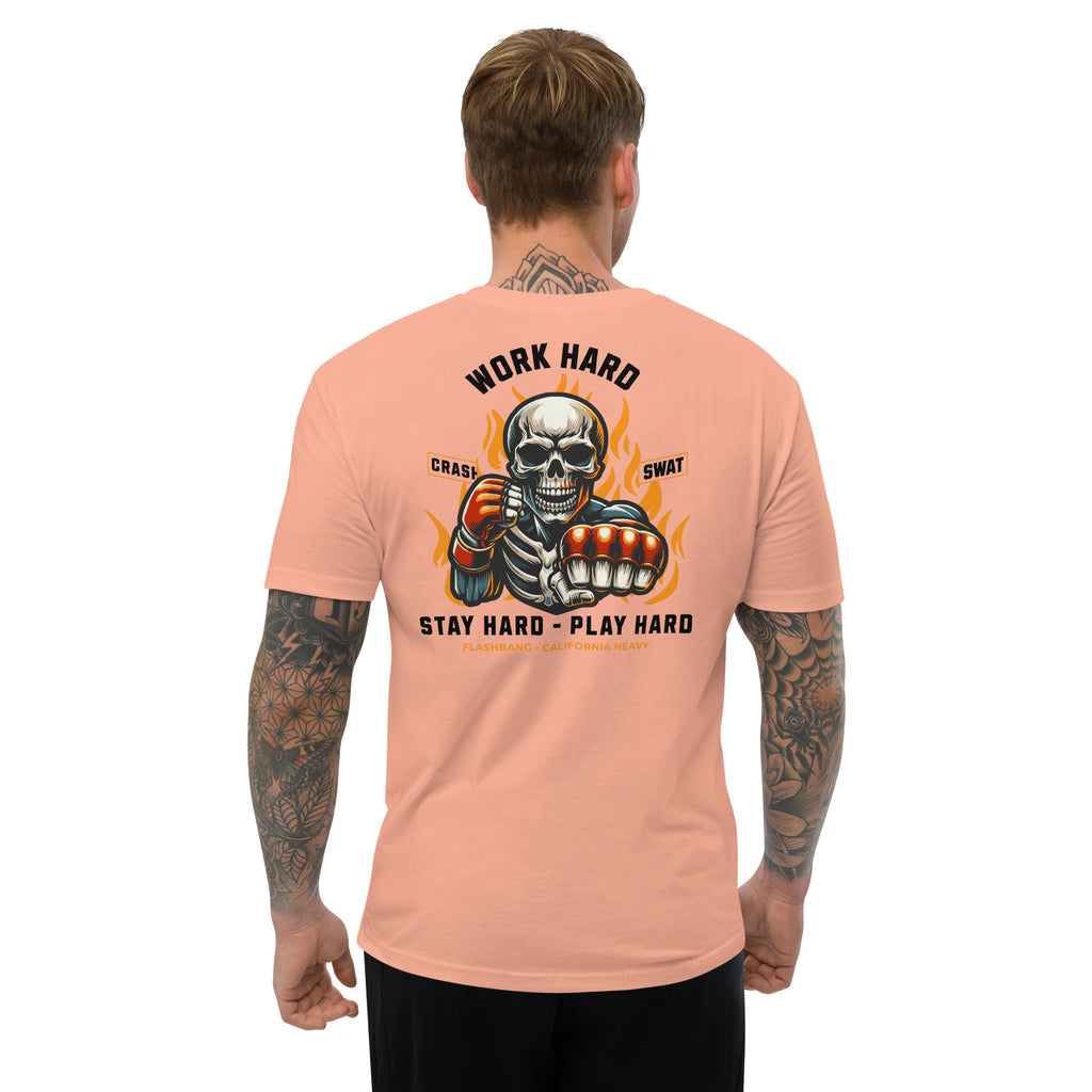 Man wearing a peach t-shirt with a graphic design and text on the back.