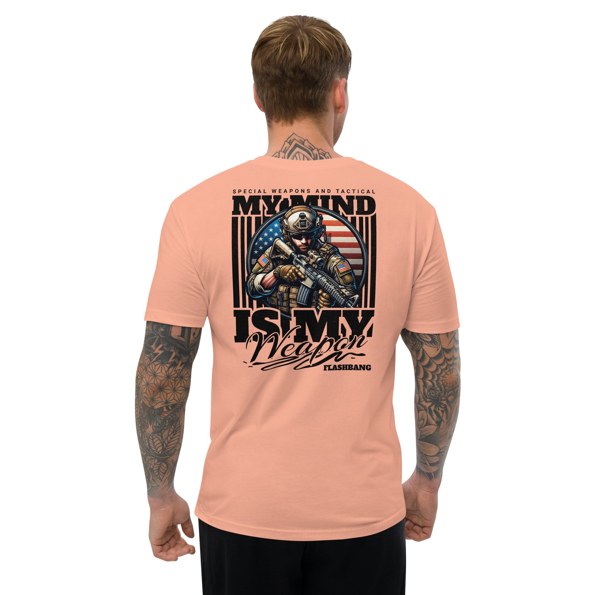 Man wearing a peach t-shirt with a graphic design on the back, featuring text and an American flag.