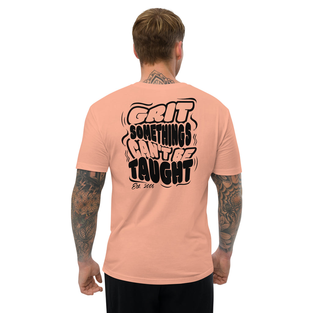 Man wearing a peach t-shirt with black text on the back, standing against a white background