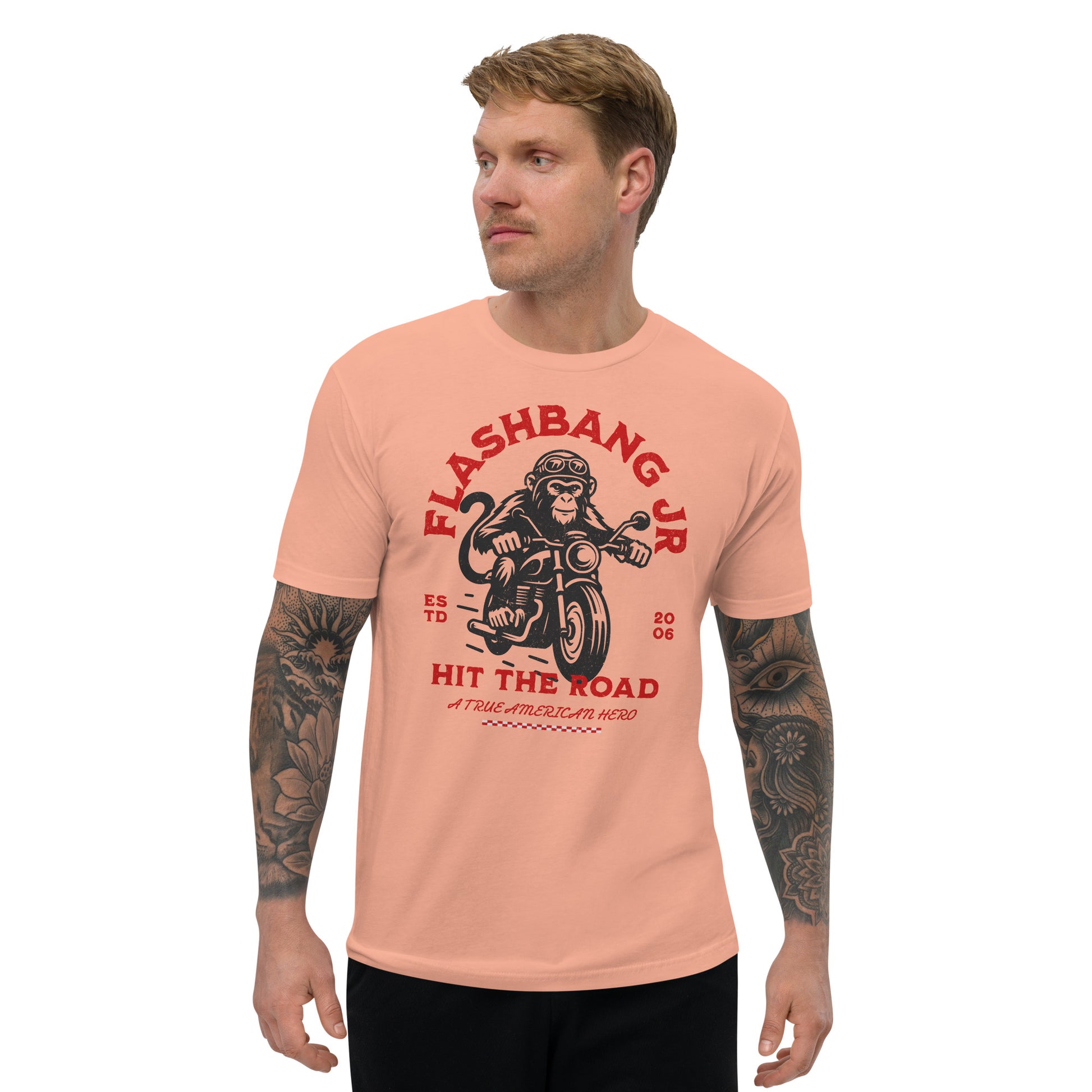 Man wearing a peach t-shirt with 'Flashbang Jr' graphic design on a white background