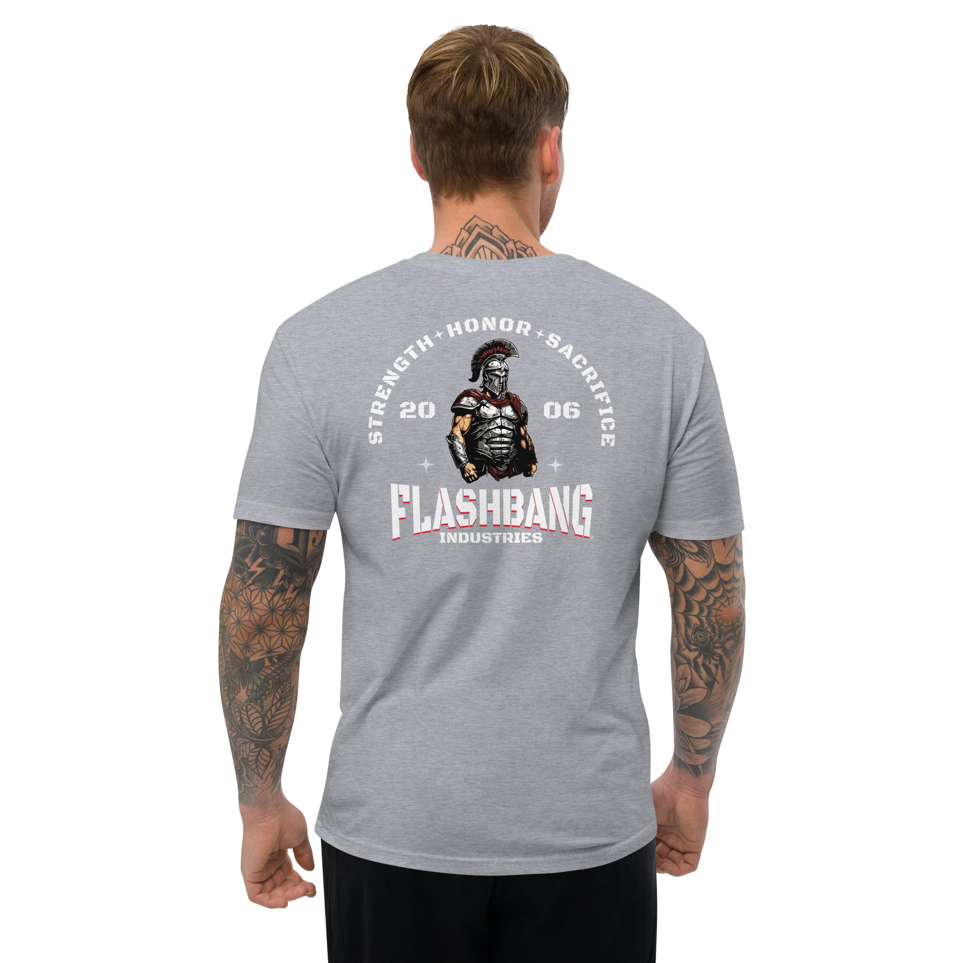 Gray t-shirt with 'Flashbang Industries' graphic on the back, worn by a person.