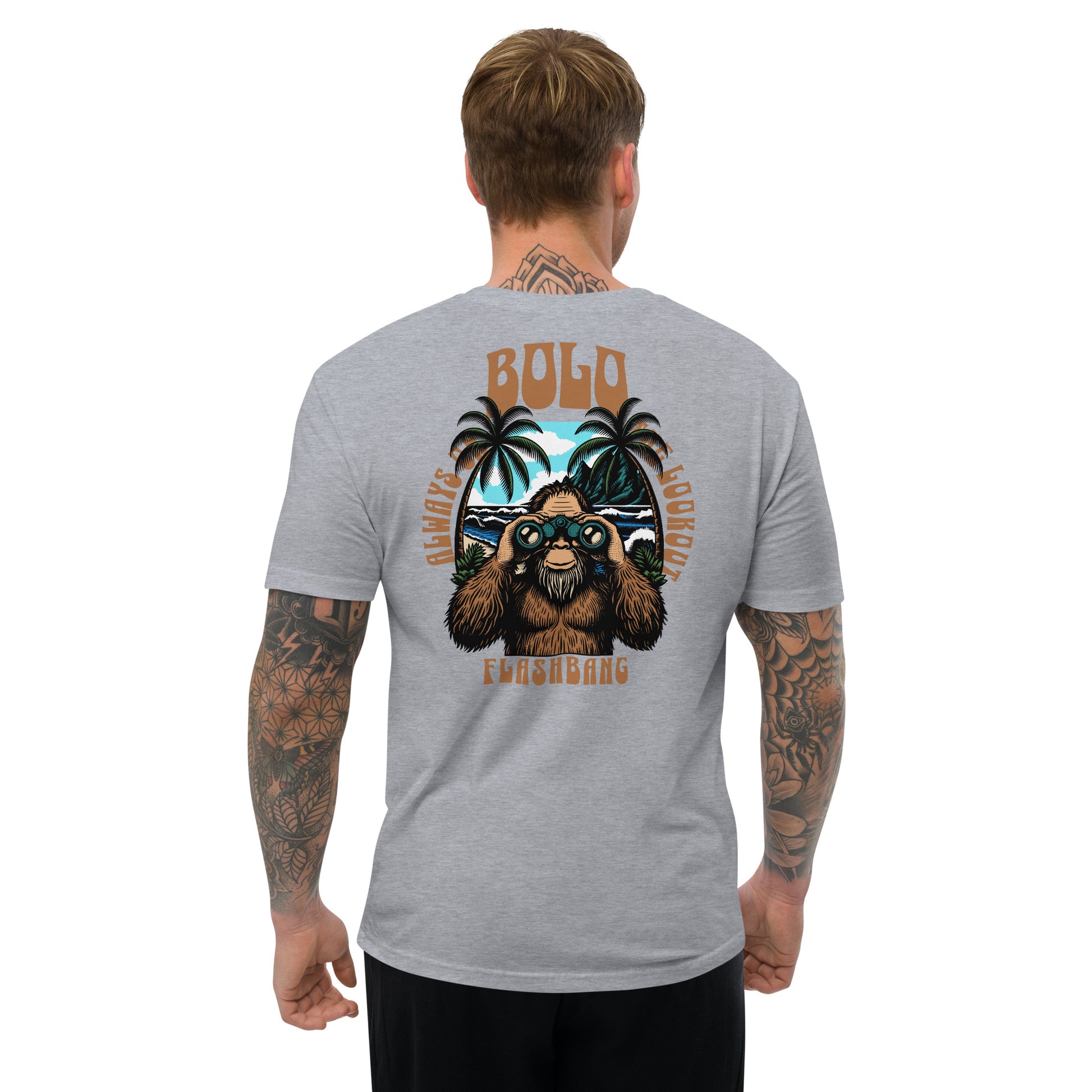Man wearing a gray t-shirt with a graphic design on the back, featuring a bear and palm trees.