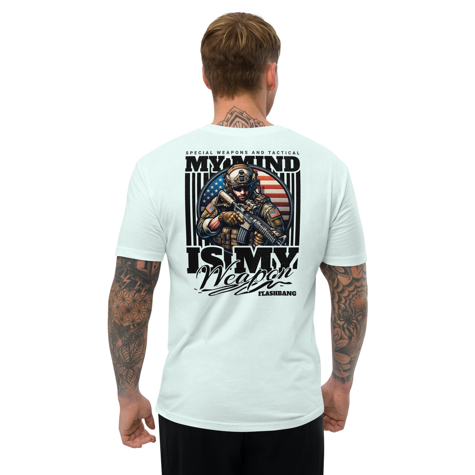 Light blue t-shirt with graphic design and text on the back, worn by a person.