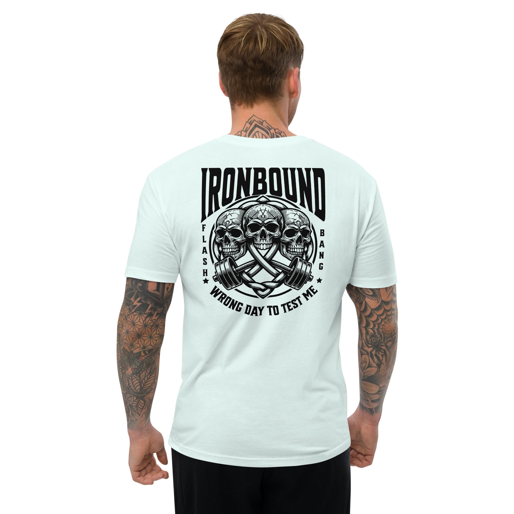 Man wearing a light blue t-shirt with 'Ironbound' design on the back, on a white background
