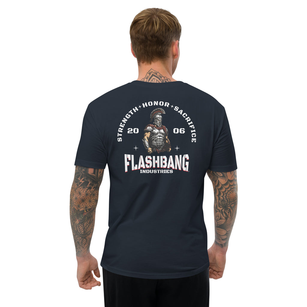 Man wearing a black t-shirt with 'Flashbang Industries' graphic design on the back.