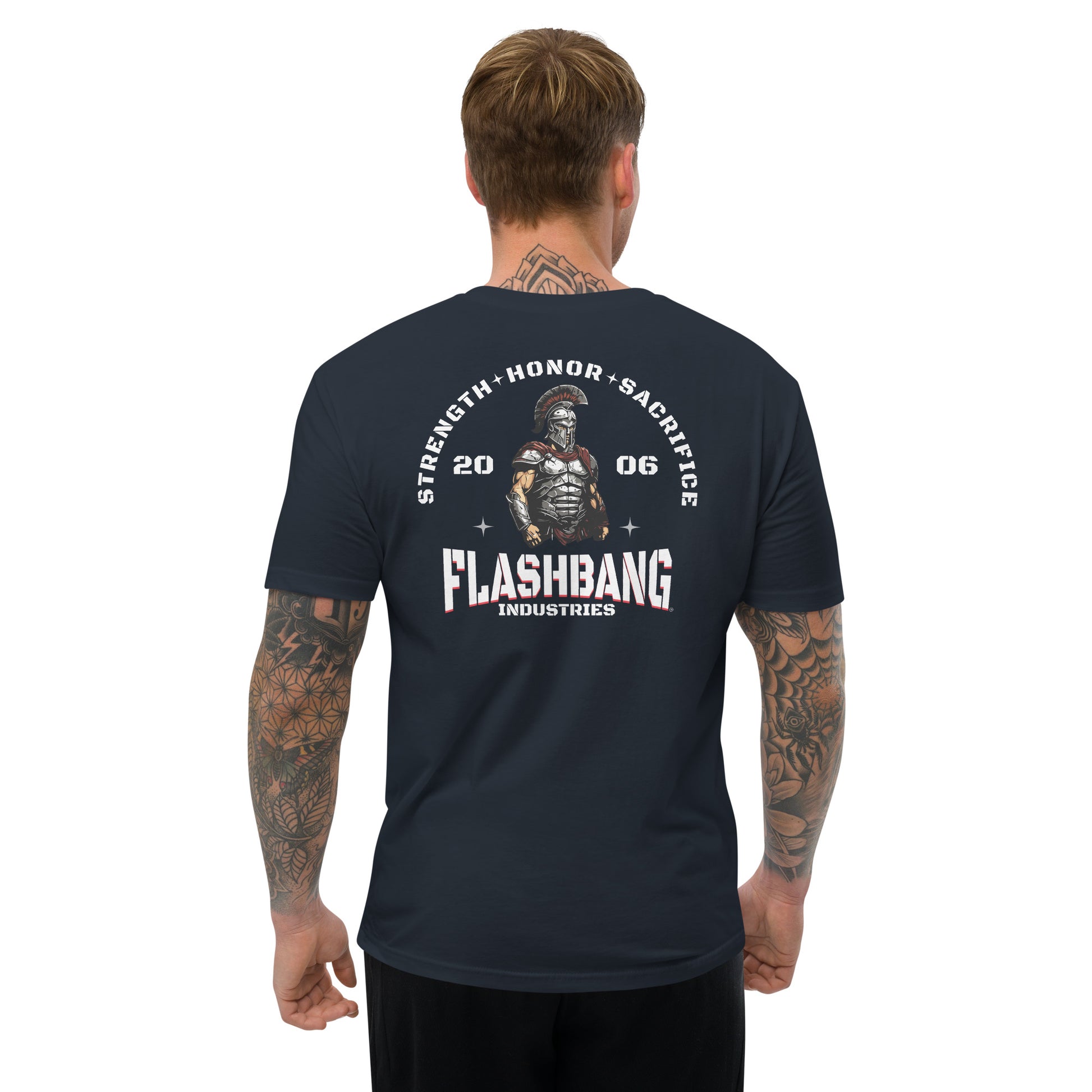 Man wearing a black t-shirt with 'Flashbang Industries' graphic design on the back.