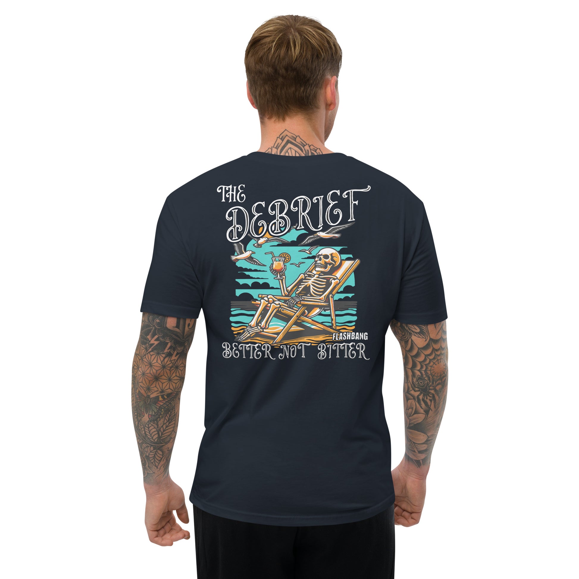 Man wearing a black t-shirt with a skeleton design and text on the back, on a white background.