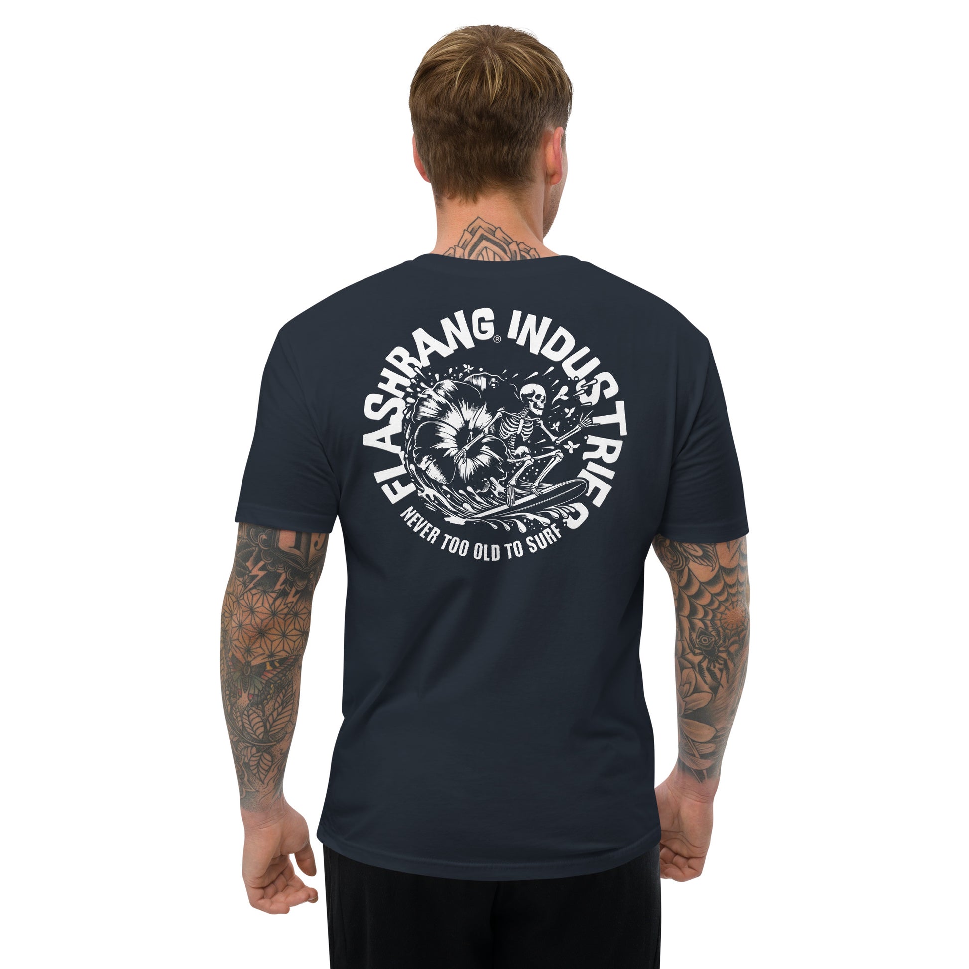 Man wearing a navy blue t-shirt with white graphic design on the back, on a white background