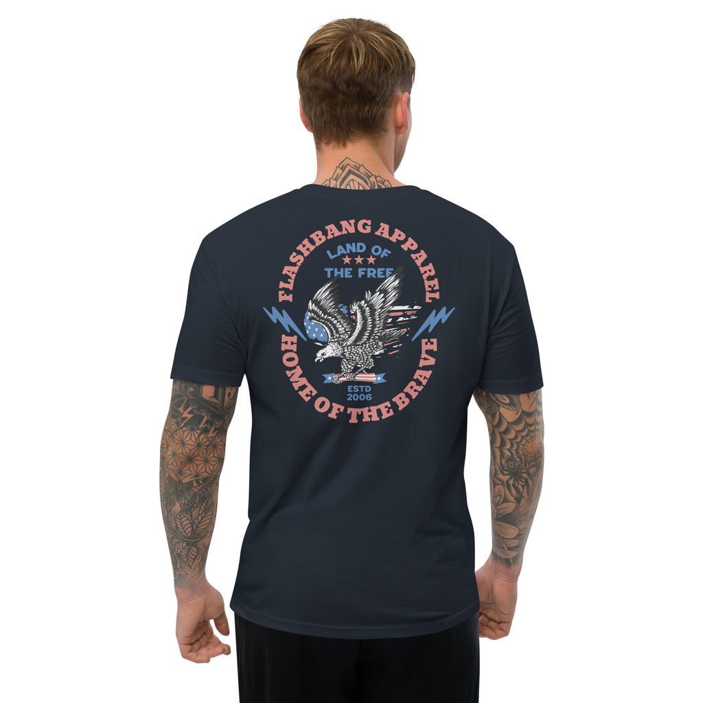 Man wearing a navy blue t-shirt with a patriotic design on the back, featuring text and an eagle emblem.