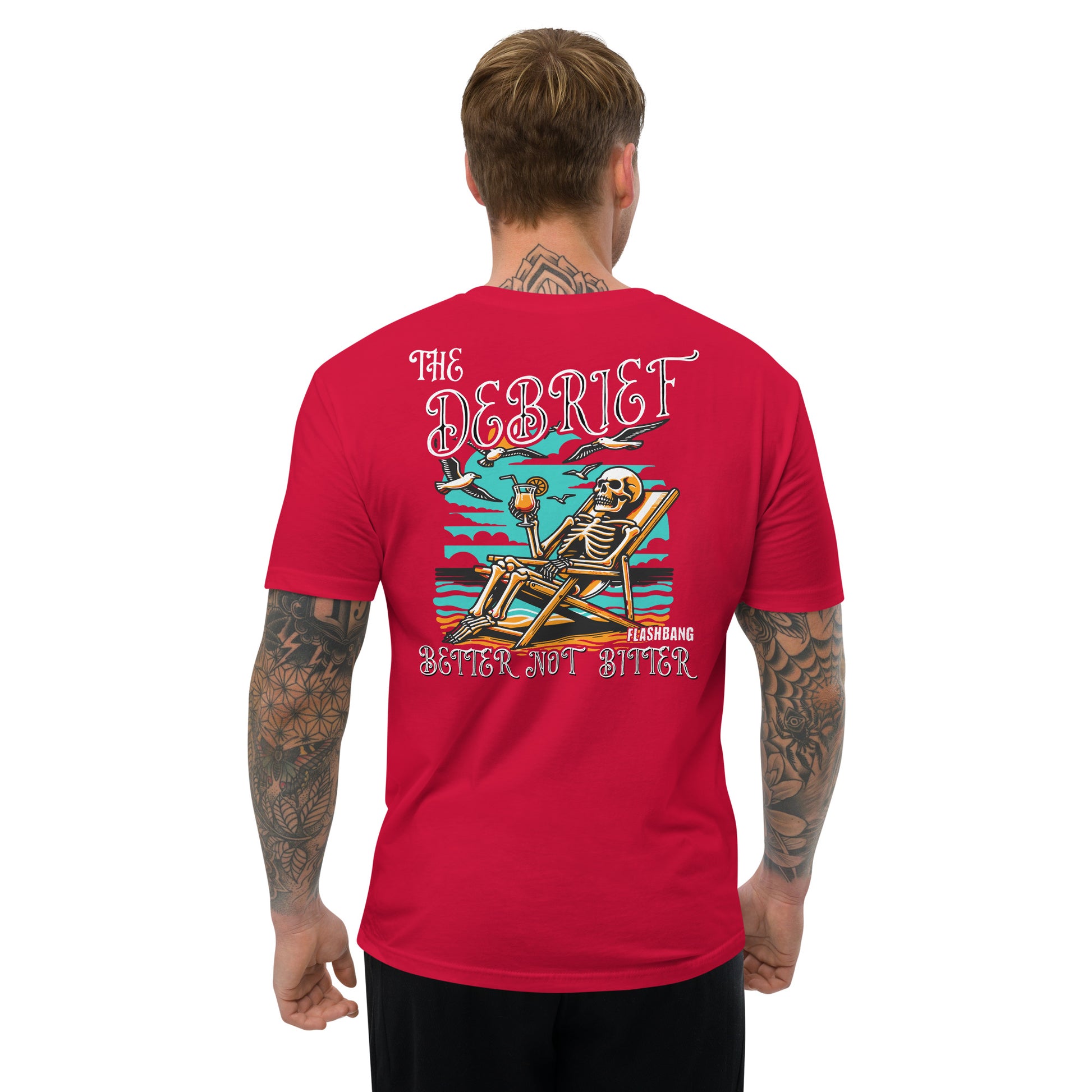 Man wearing a red t-shirt with a skeleton design on the back, standing against a white background.