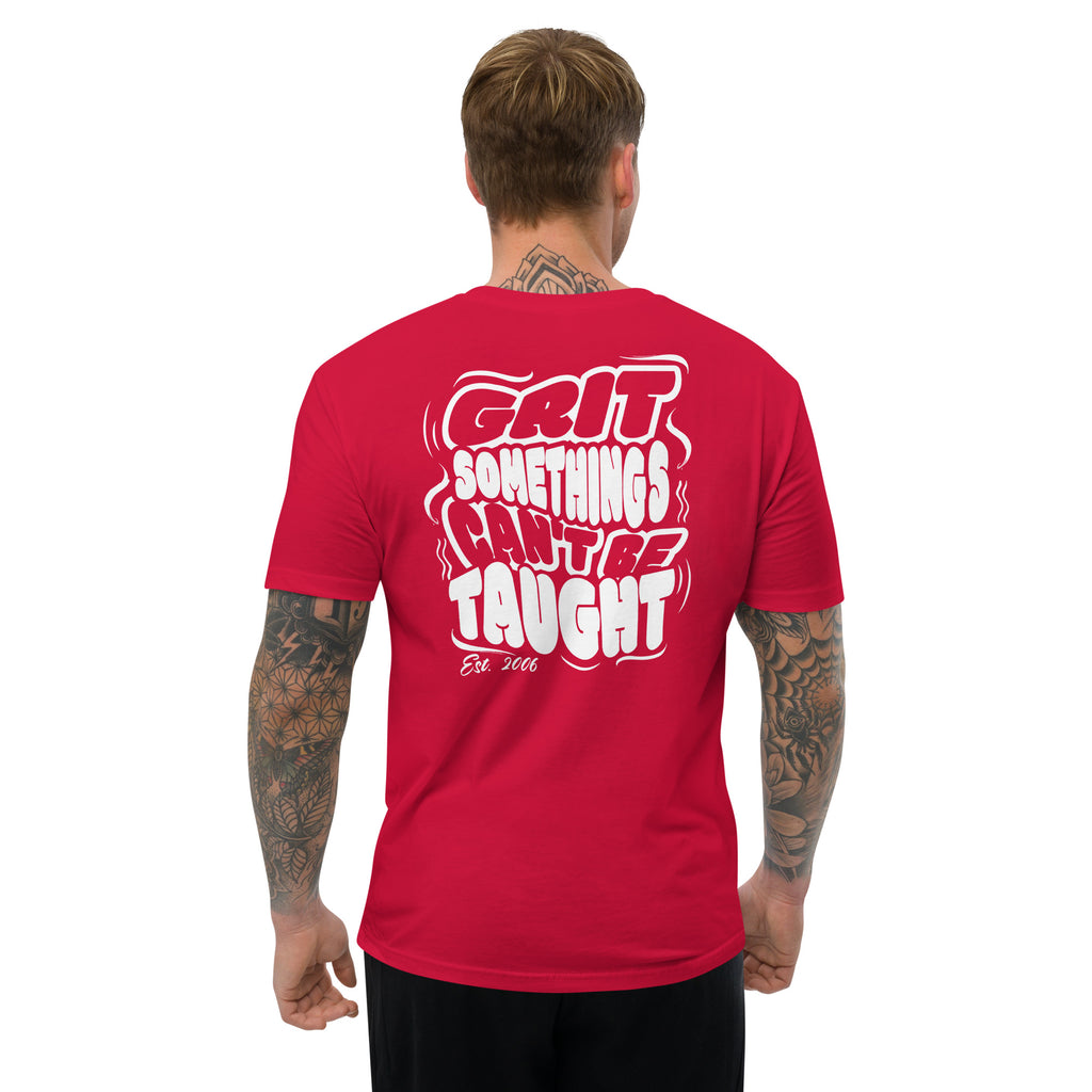 Man wearing a red t-shirt with white text on the back, standing against a white background