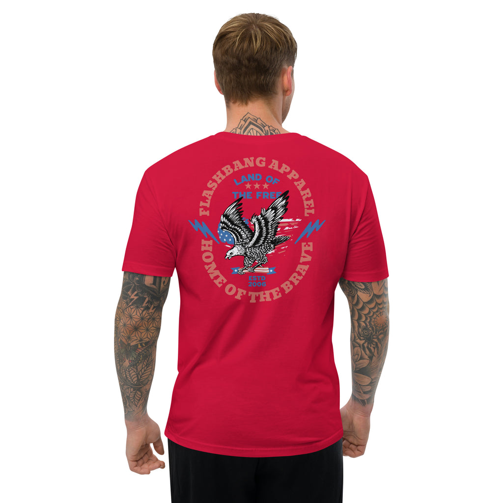 Red t-shirt with an eagle graphic and text on the back, worn by a person.