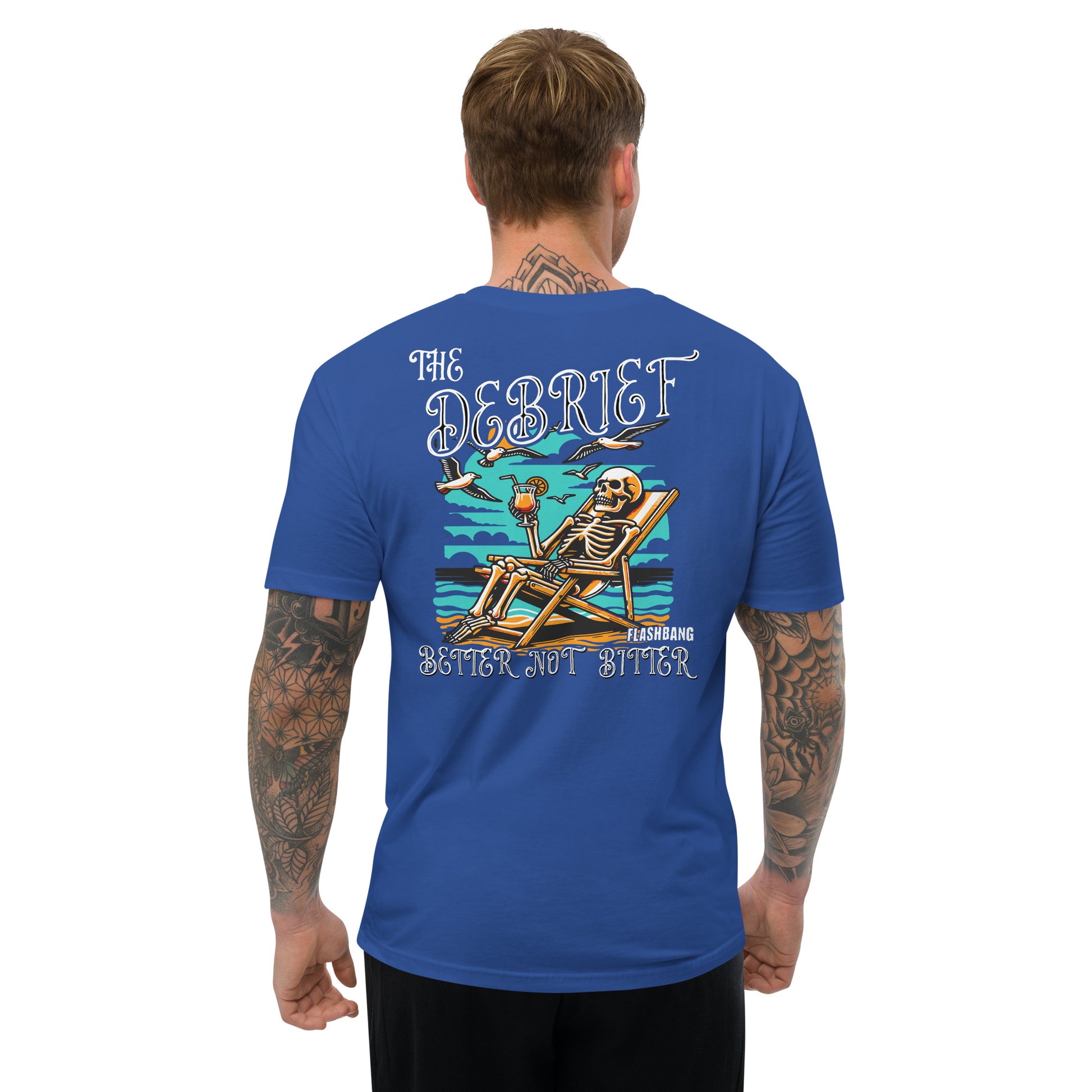 Man wearing a blue t-shirt with a skeleton design and text on the back, on a white background.