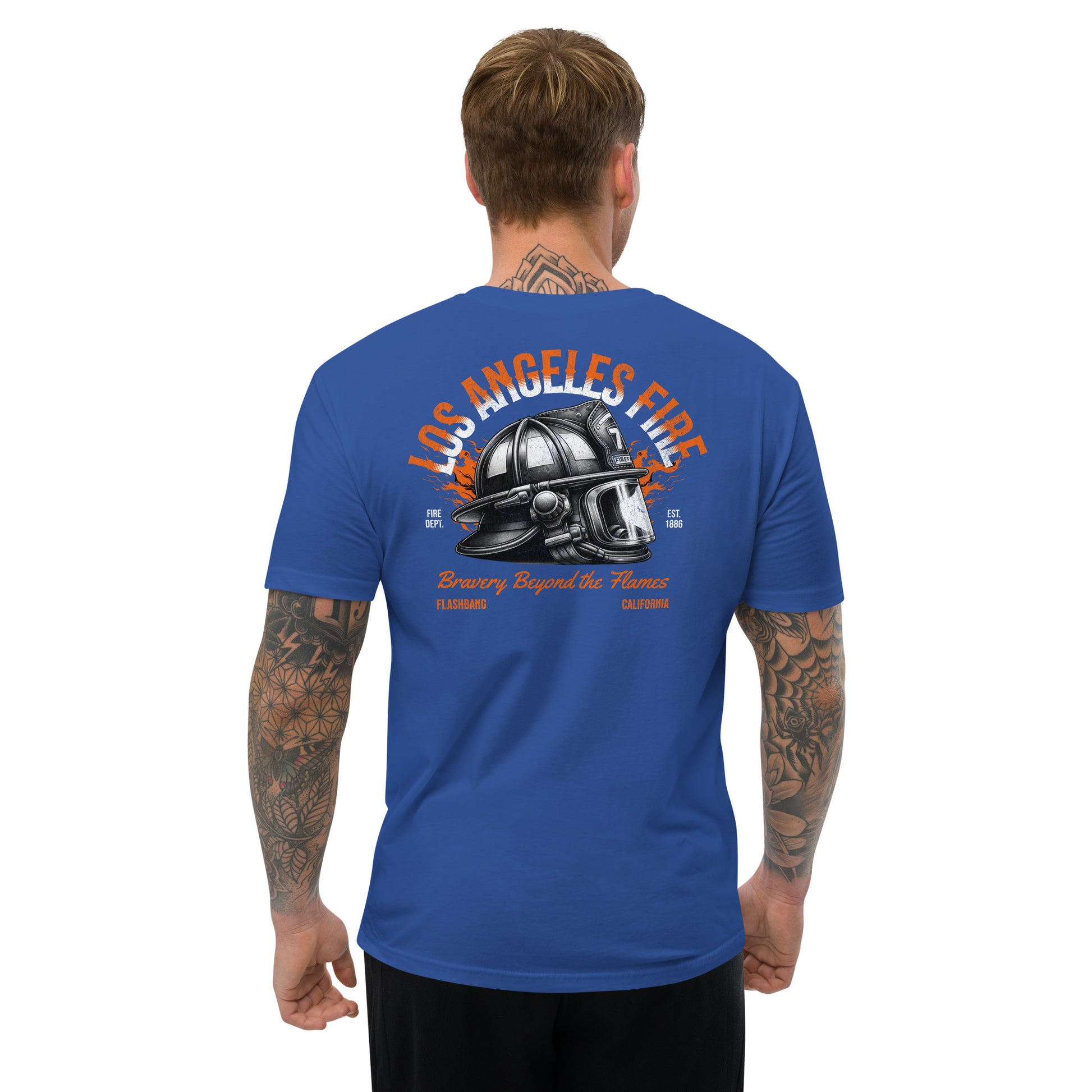 Man wearing a blue t-shirt with a graphic design on the back, featuring text and a helmet.