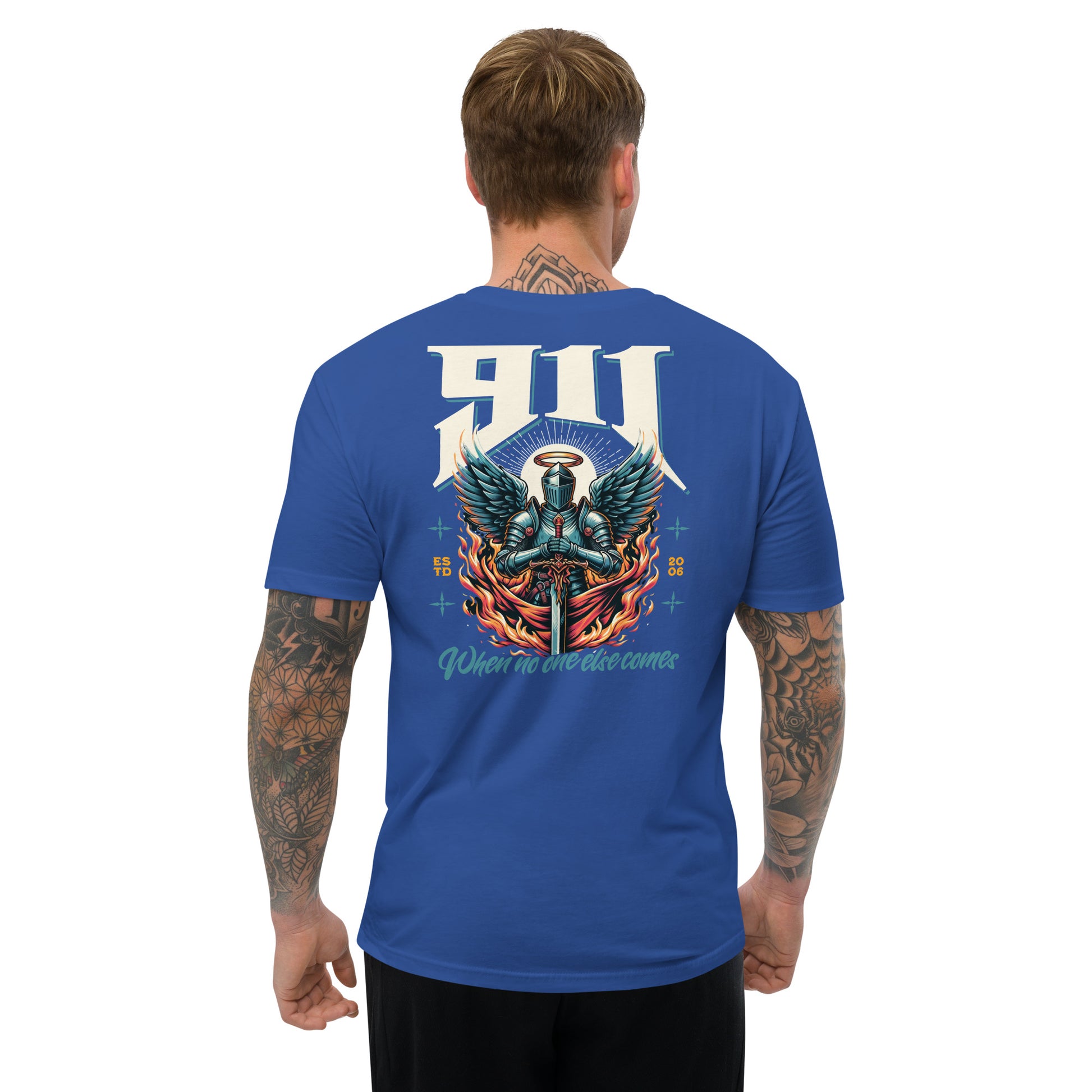 Man wearing a blue t-shirt with a graphic design on the back, standing against a white background