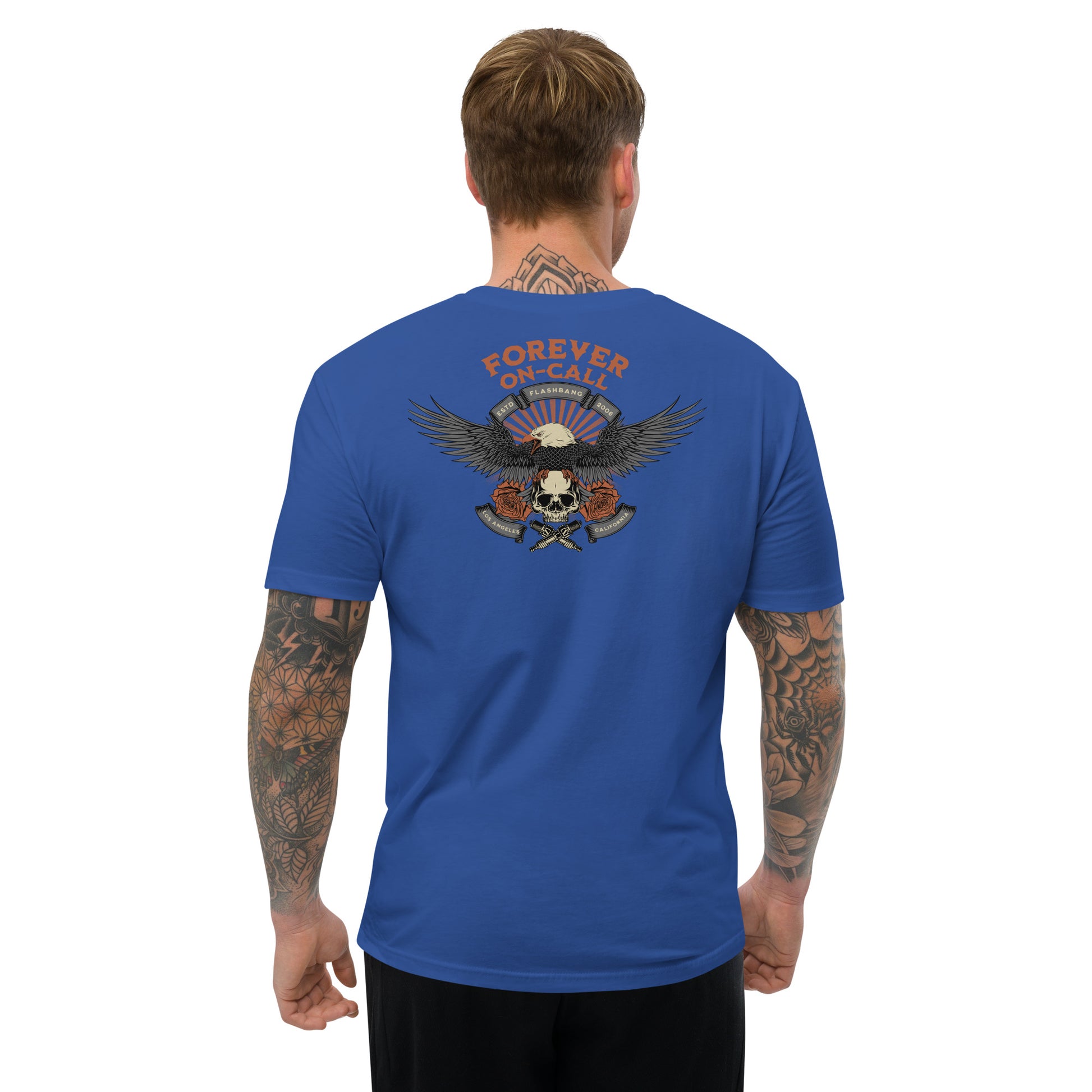 Man wearing a blue t-shirt with a graphic design on the back, featuring text and an eagle.