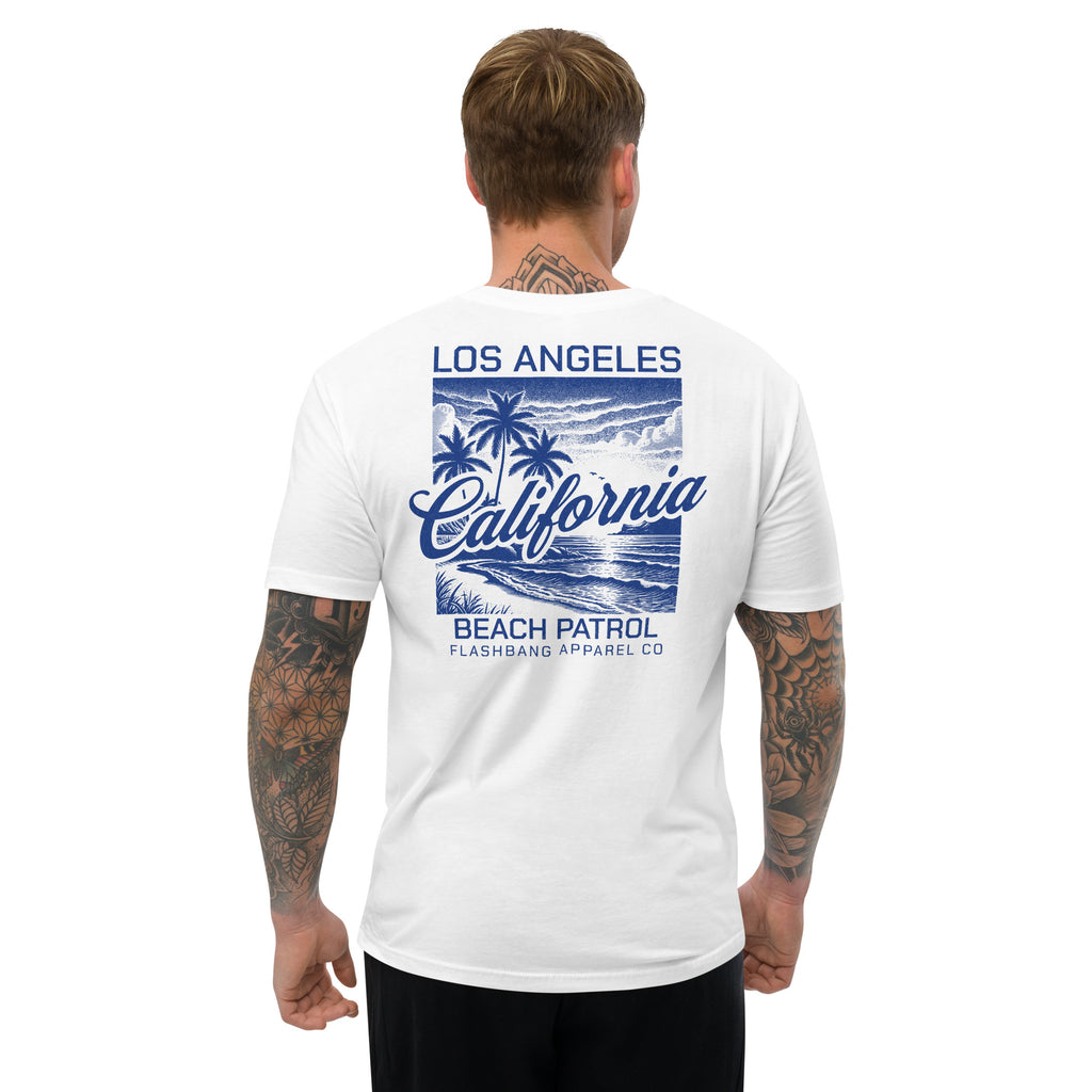 Man wearing a white t-shirt with 'Los Angeles California Beach Patrol' design on the back.