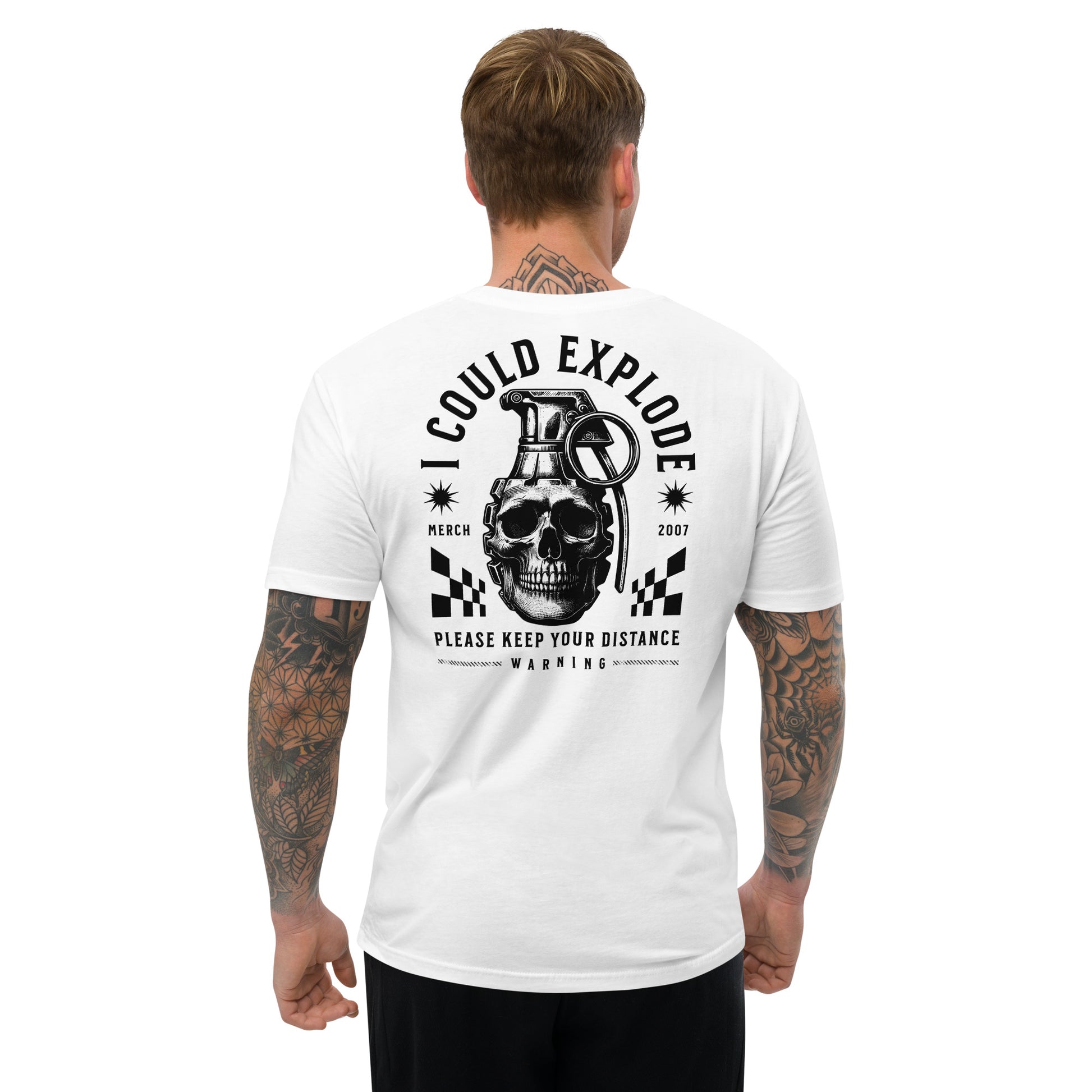 Man wearing a white t-shirt with a graphic design on the back featuring a skull and grenade.