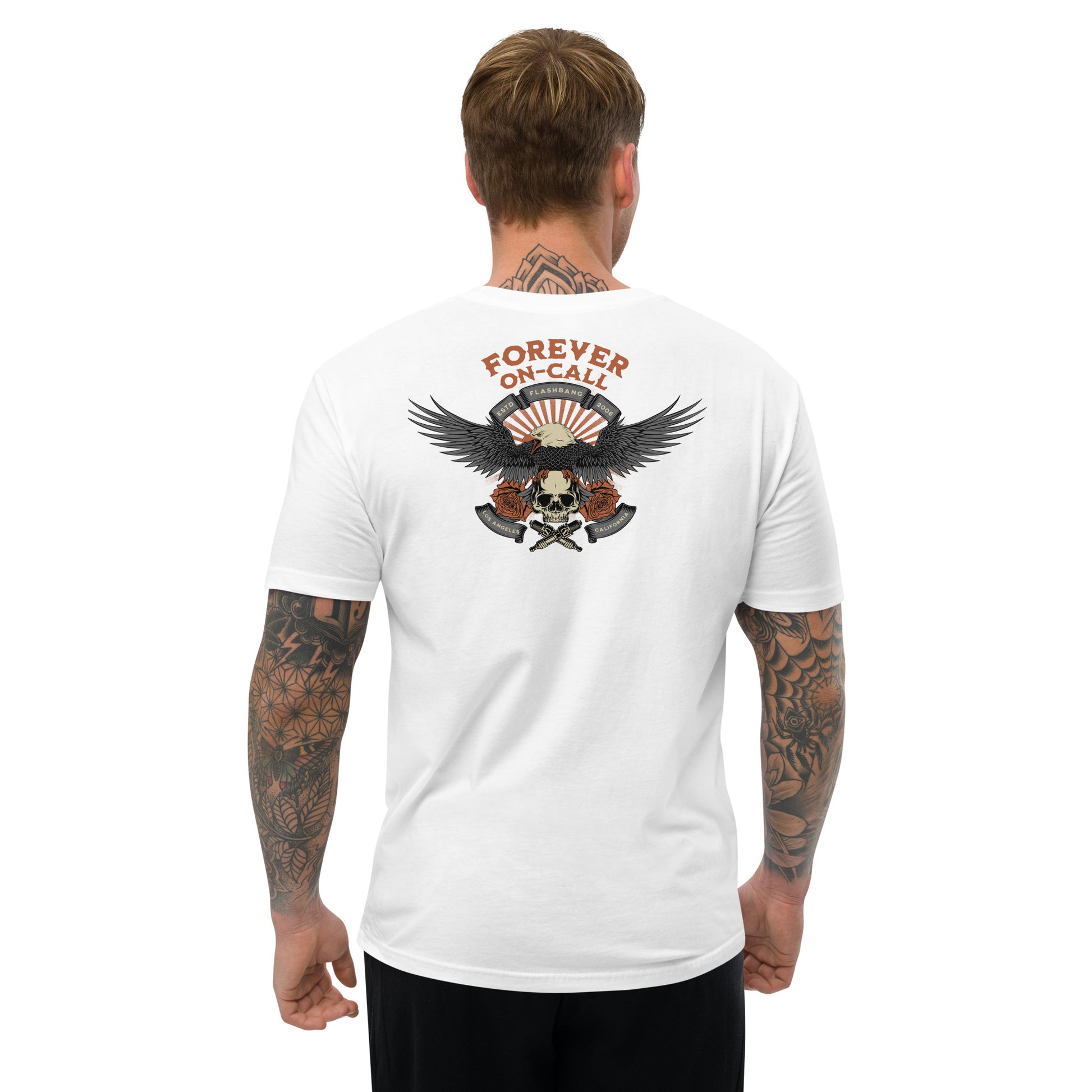 Man wearing a white t-shirt with a graphic design on the back, featuring an eagle and skull, on a white background.