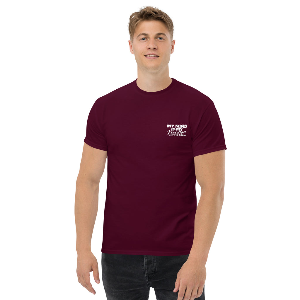 Man wearing a maroon t-shirt with a logo on a white background