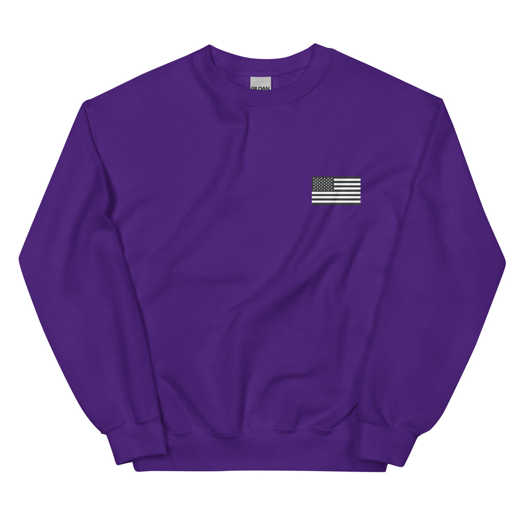 Purple sweatshirt with a small American flag patch on a white background