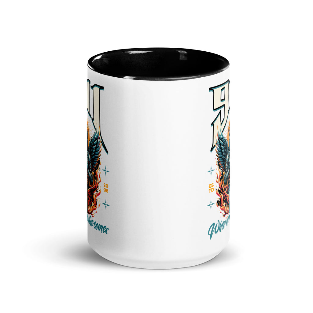 White mug with black interior and colorful design on a white background