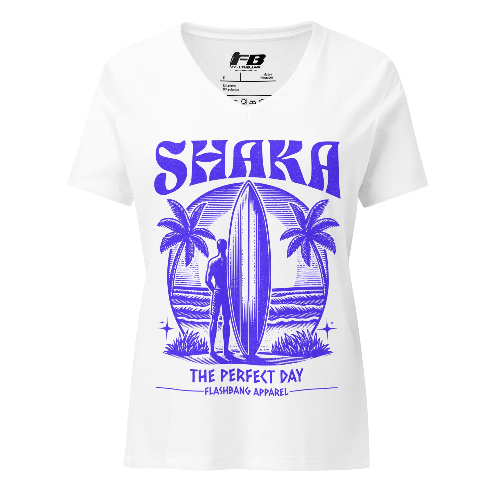 White t-shirt with purple 'SHAKA' design featuring a surfer and palm trees, branded with Flashbang Apparel.